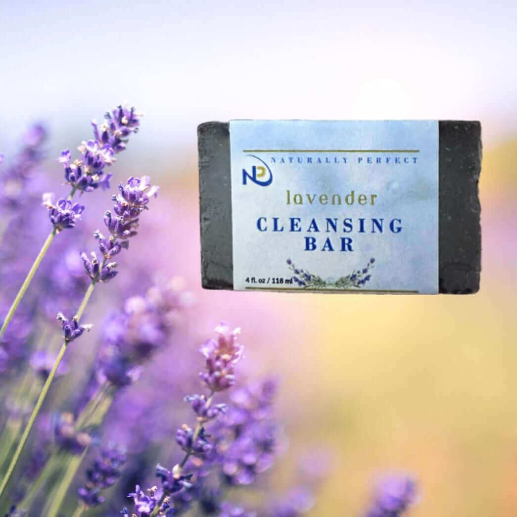 NP Lavender Cleansing Bar surrounded by lavender flowers, highlighting natural ingredients and soothing properties.